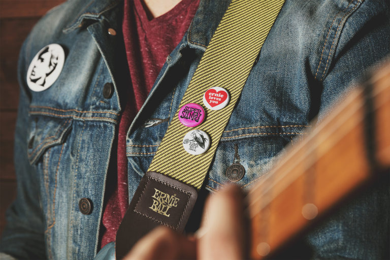Ernie Ball Tweed Guitar Strap with Colors of Rock'N'Roll badges